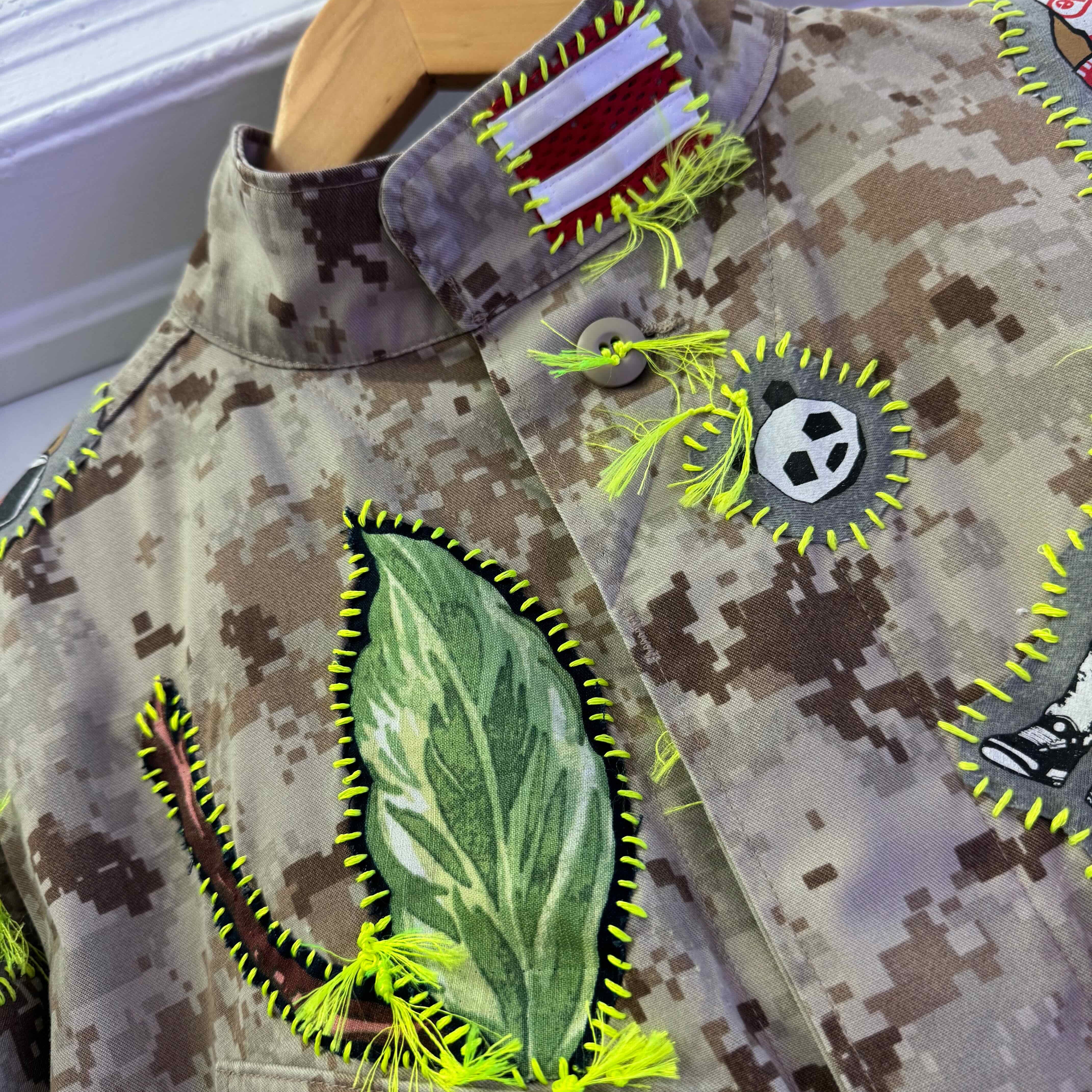 Snobiety Jacket
One-of-a-kind reclaimed camo jacket, hand-embroidered with vintage floral embroidery 
