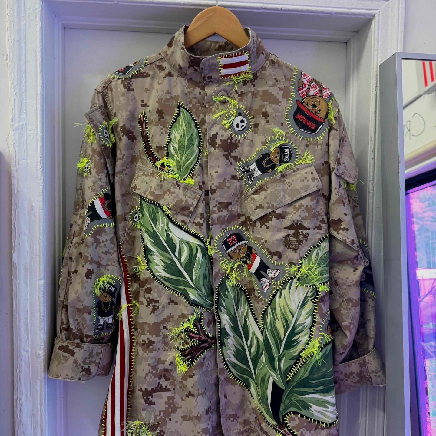 Snobiety Jacket
One-of-a-kind reclaimed camo jacket, hand-embroidered with vintage floral embroidery 