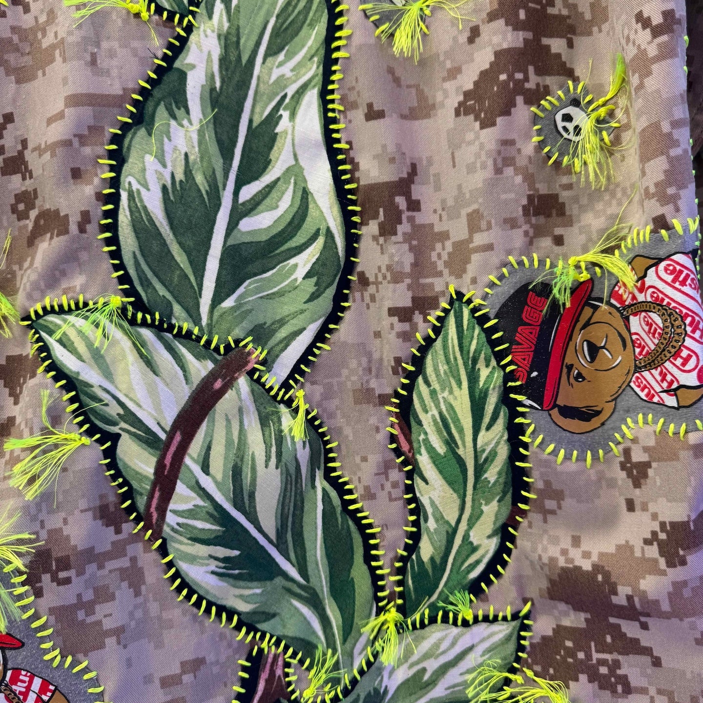 Snobiety Jacket
One-of-a-kind reclaimed camo jacket, hand-embroidered with vintage floral embroidery 