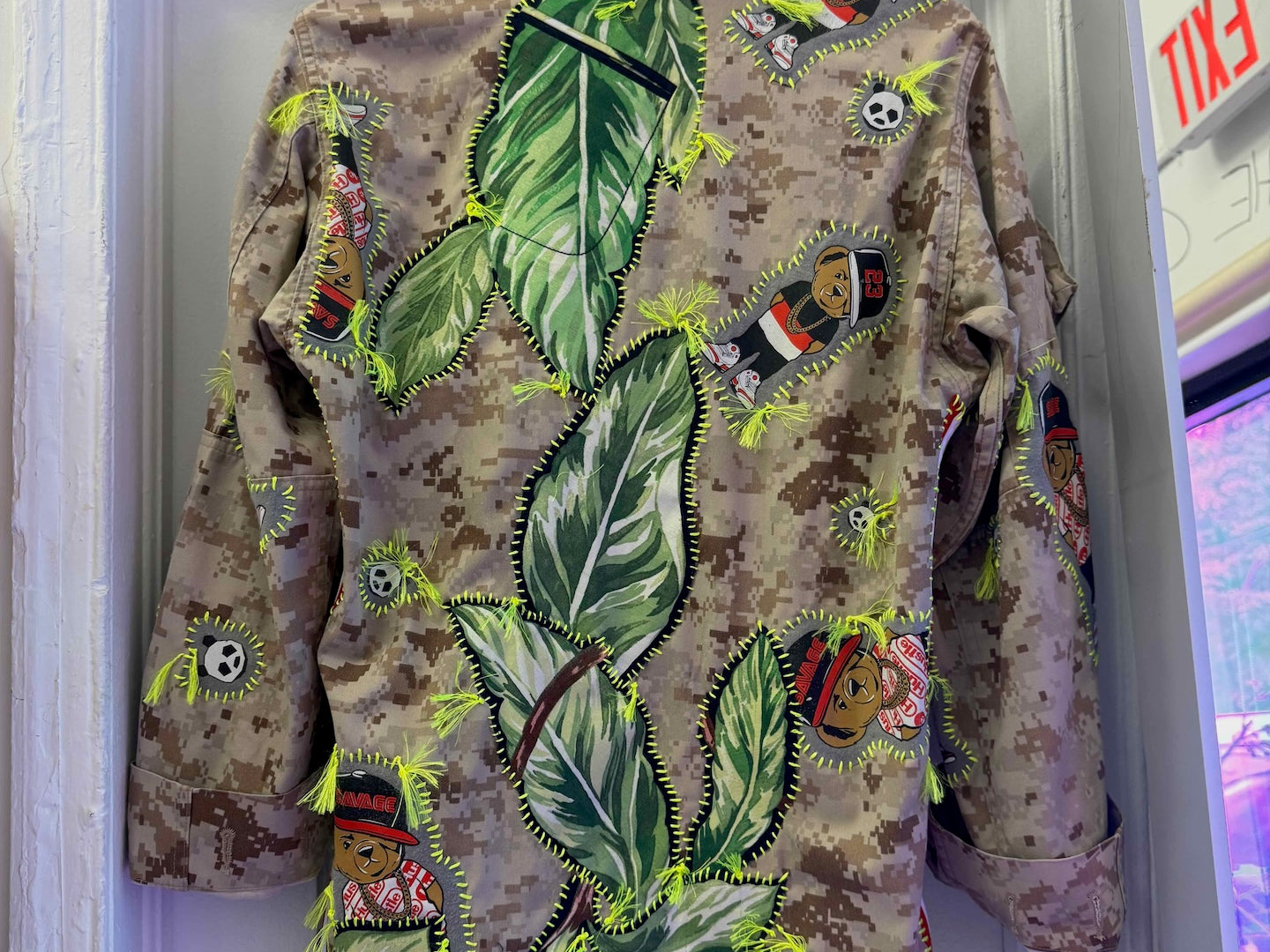 Snobiety Jacket
One-of-a-kind reclaimed camo jacket, hand-embroidered with vintage floral embroidery 