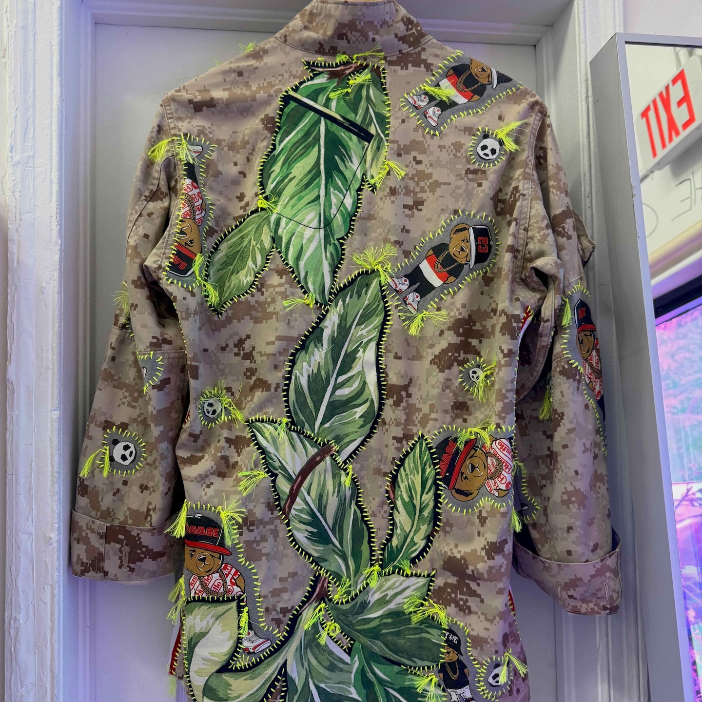 Snobiety Jacket
One-of-a-kind reclaimed camo jacket, hand-embroidered with vintage floral embroidery 