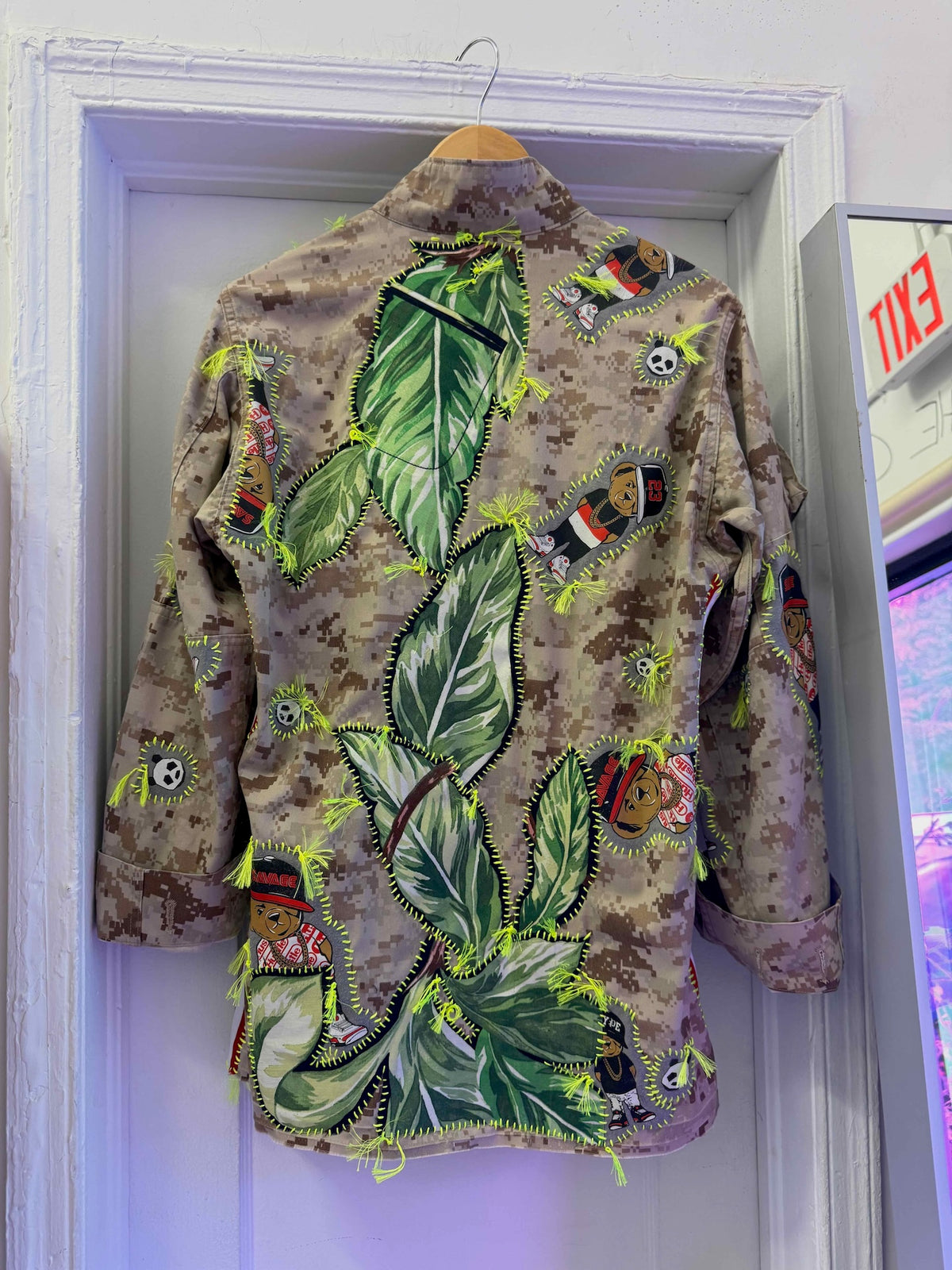 Snobiety Jacket
One-of-a-kind reclaimed camo jacket, hand-embroidered with vintage floral embroidery 