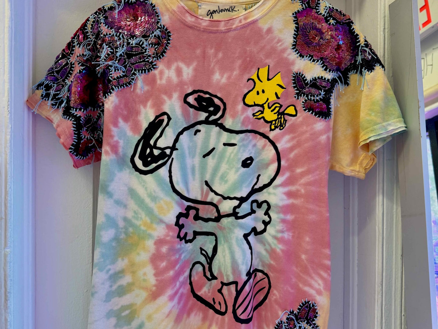 One-of-a-kind upcycled tie-dye Snoopy t-shirt with hand-embroidered sequin flowers by Gontovnik