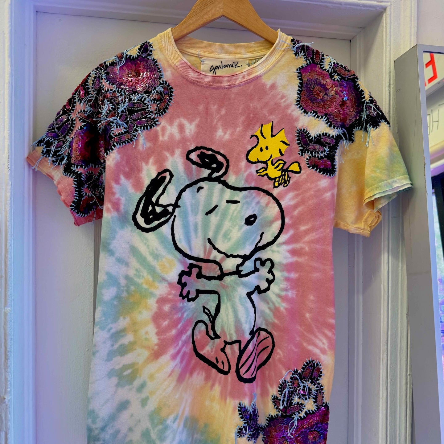 One-of-a-kind upcycled tie-dye Snoopy t-shirt with hand-embroidered sequin flowers by Gontovnik