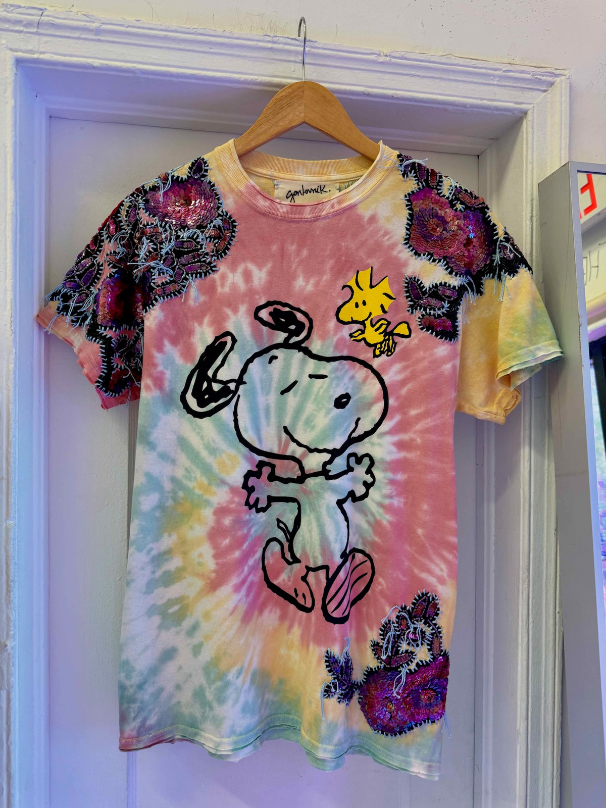 One-of-a-kind upcycled tie-dye Snoopy t-shirt with hand-embroidered sequin flowers by Gontovnik