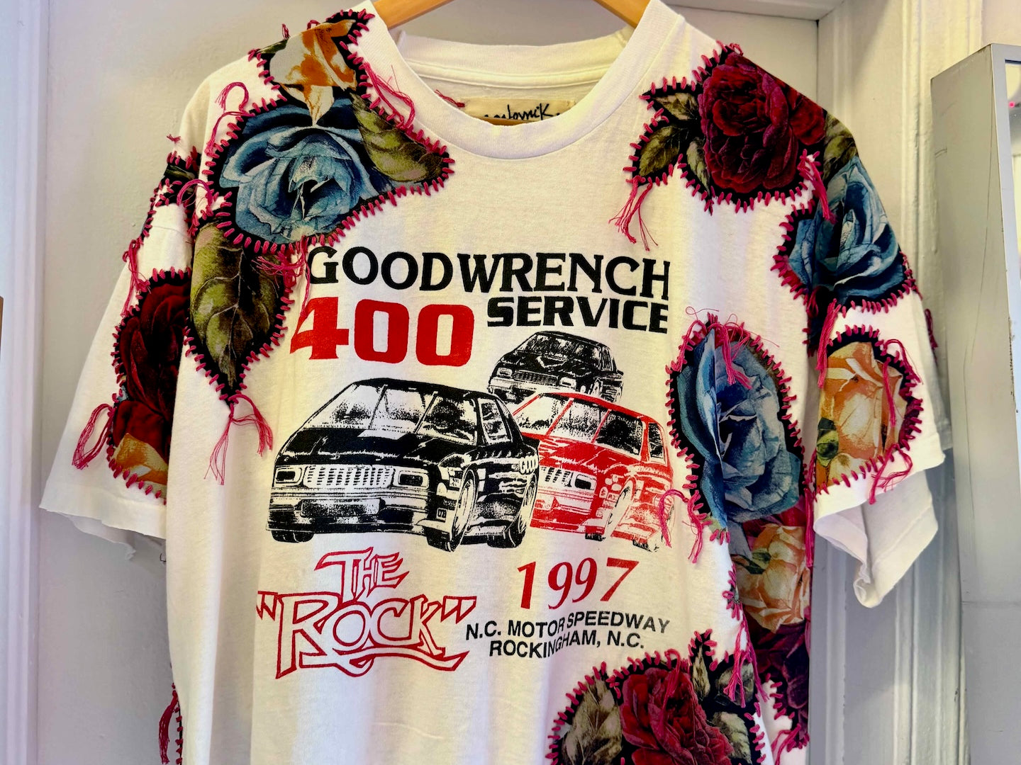 One-of-a-kind upcycled t-shirt with hand-stitched floral embroidery by Gontovnik