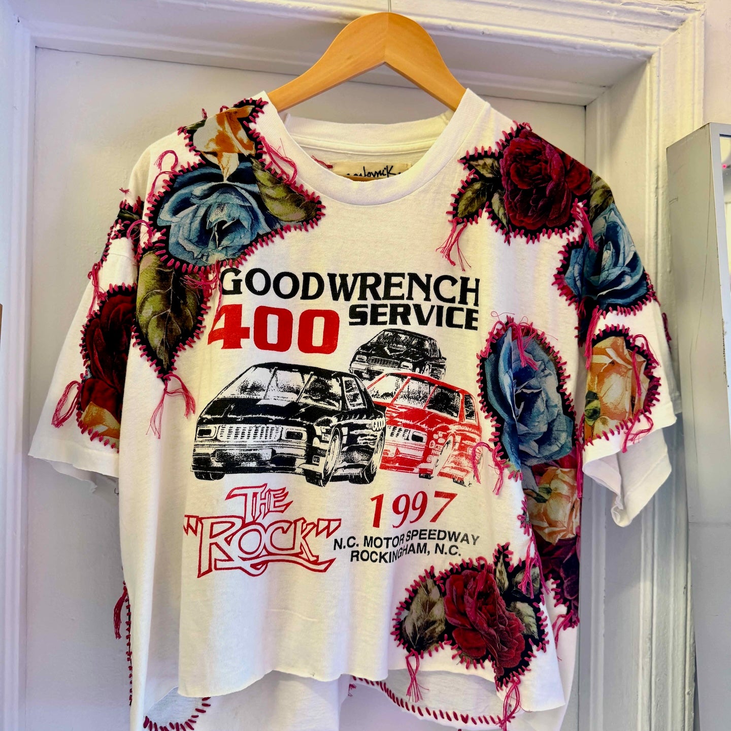 One-of-a-kind upcycled t-shirt with hand-stitched floral embroidery by Gontovnik