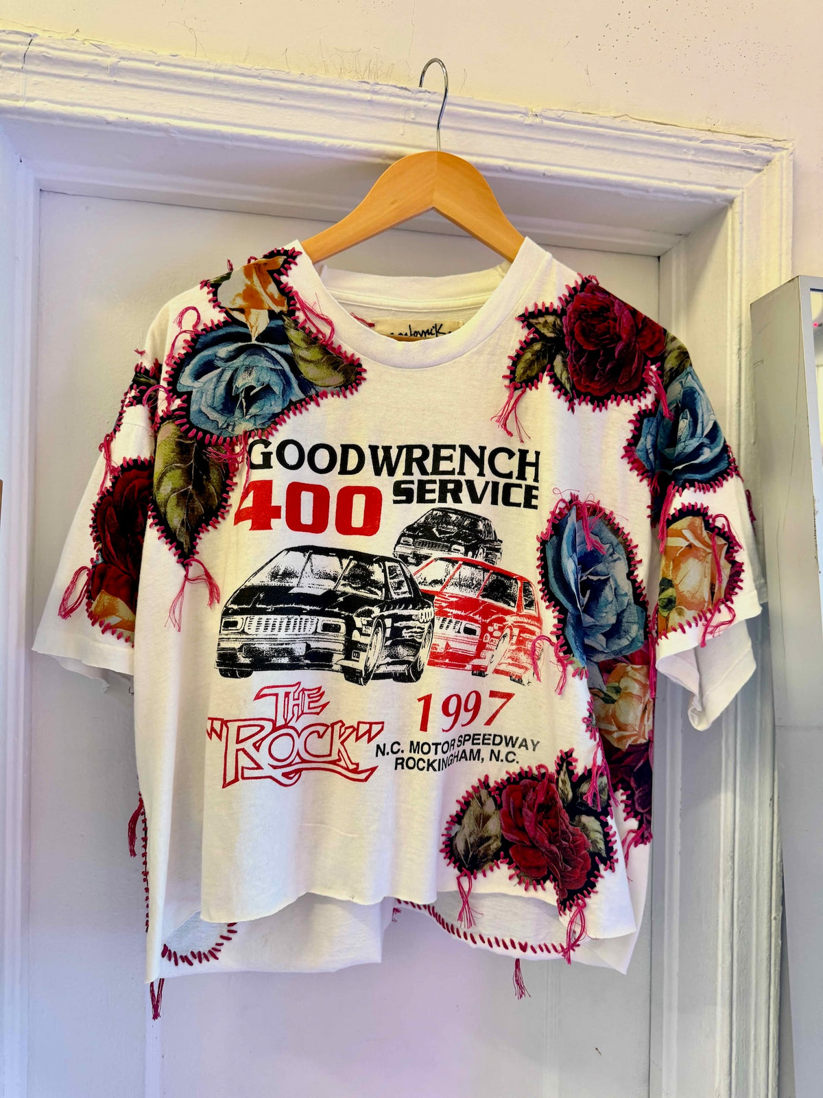 One-of-a-kind upcycled t-shirt with hand-stitched floral embroidery by Gontovnik