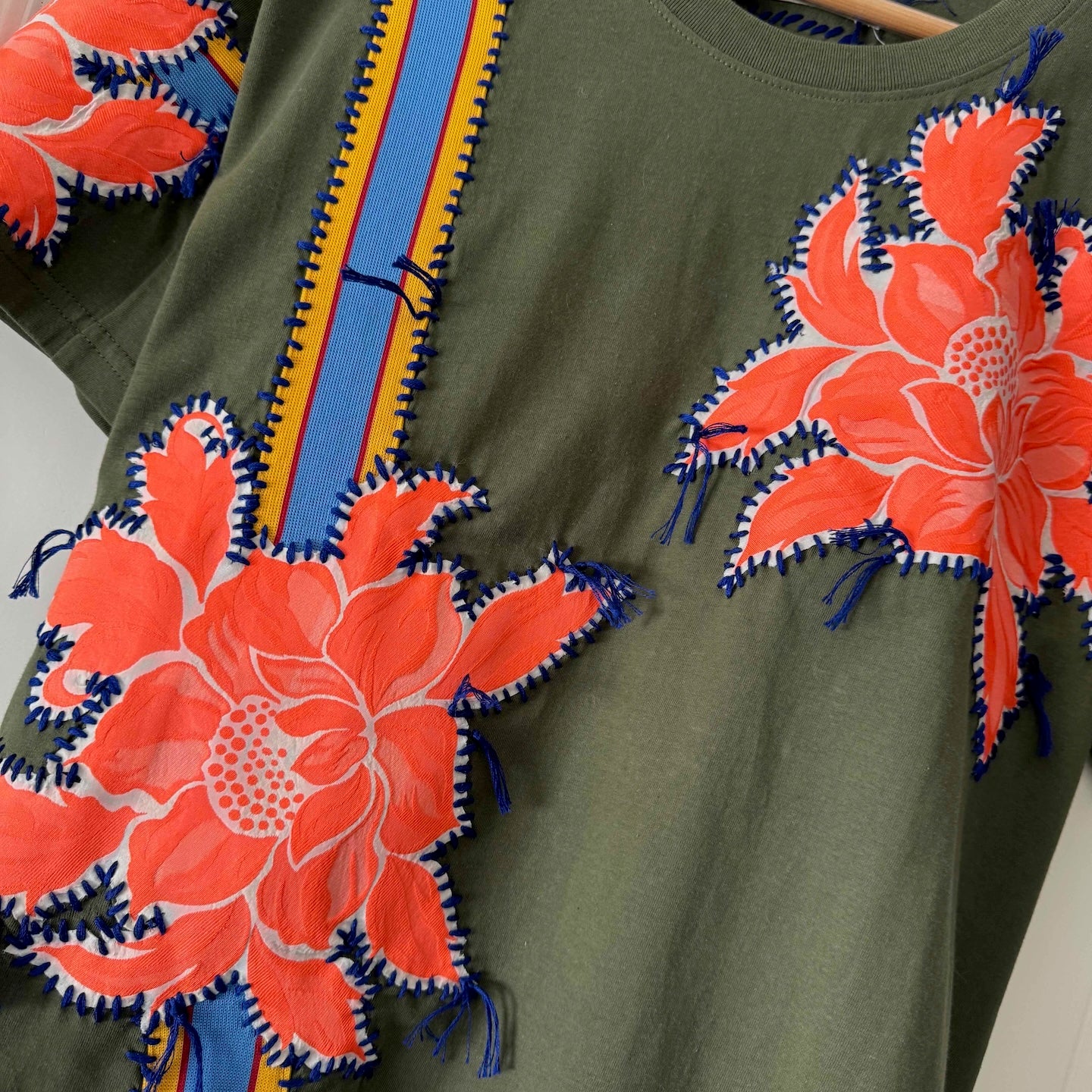 One-of-a-kin upcycled cotton t-shirt with hand-stitched floral embroidery by Gontovnik