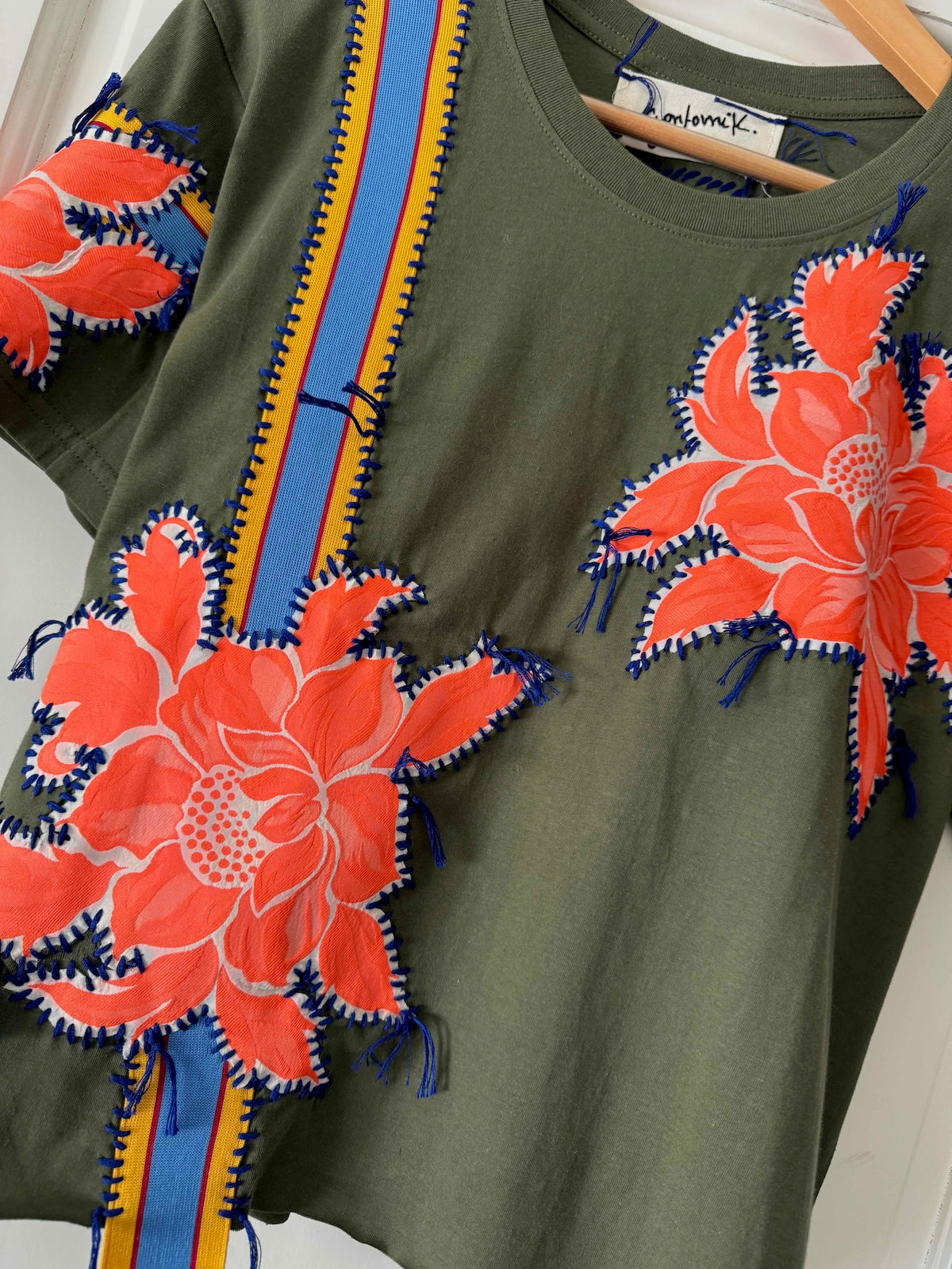 One-of-a-kin upcycled cotton t-shirt with hand-stitched floral embroidery by Gontovnik