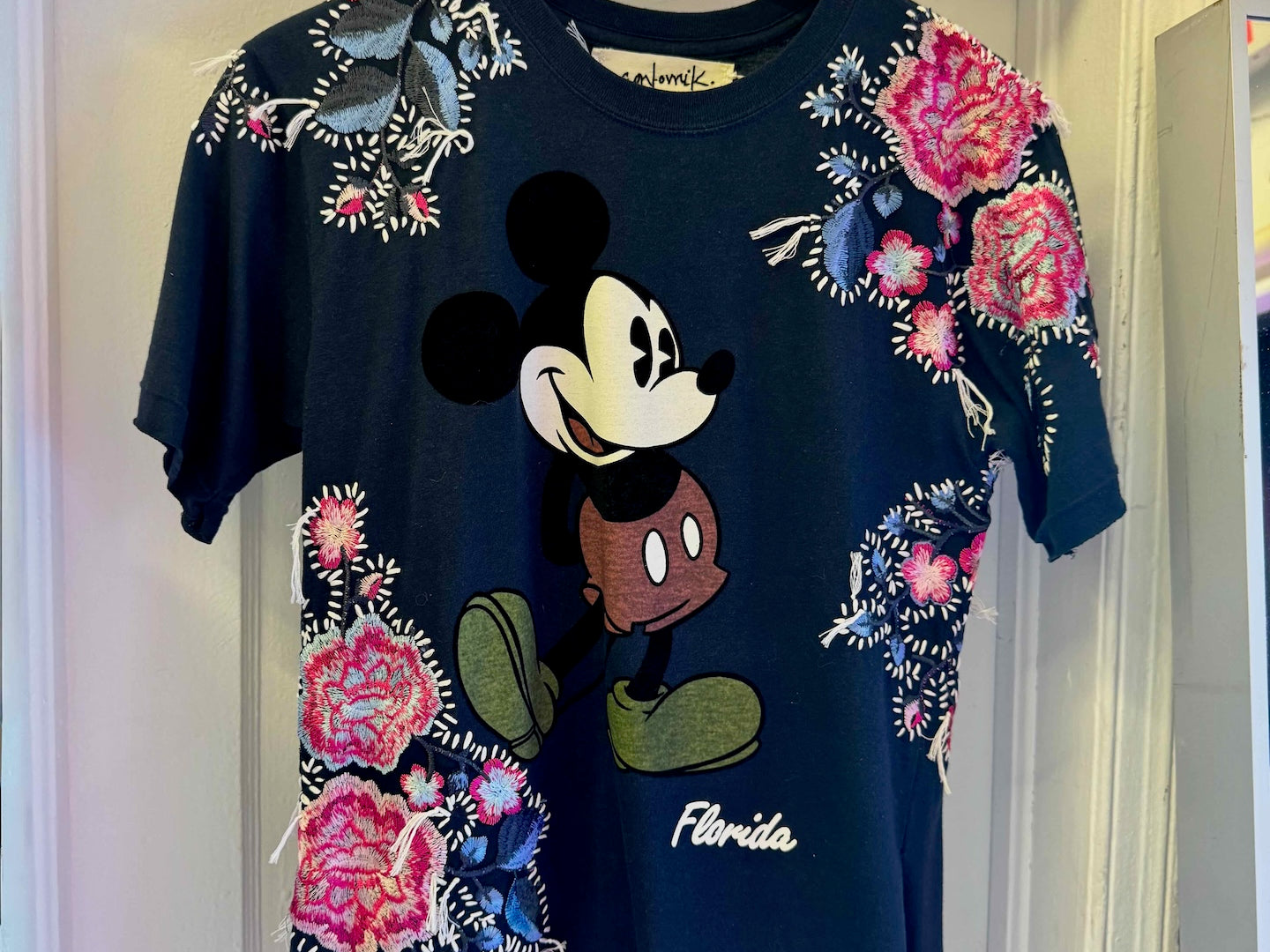 The Floridian Mickey T-Shirt
One-of-a-kind reclaimed t-shirt, hand-embroidered with vintage floral embroidery 