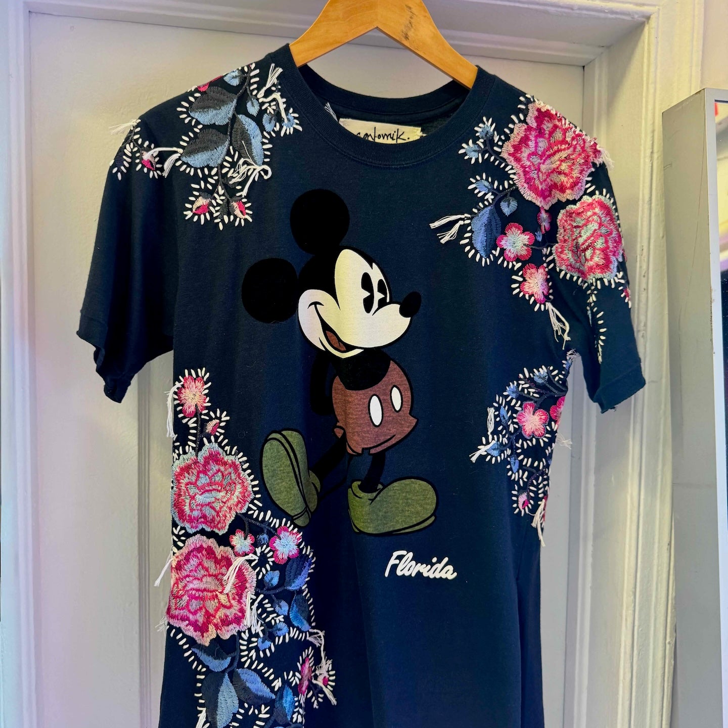 The Floridian Mickey T-Shirt
One-of-a-kind reclaimed t-shirt, hand-embroidered with vintage floral embroidery 