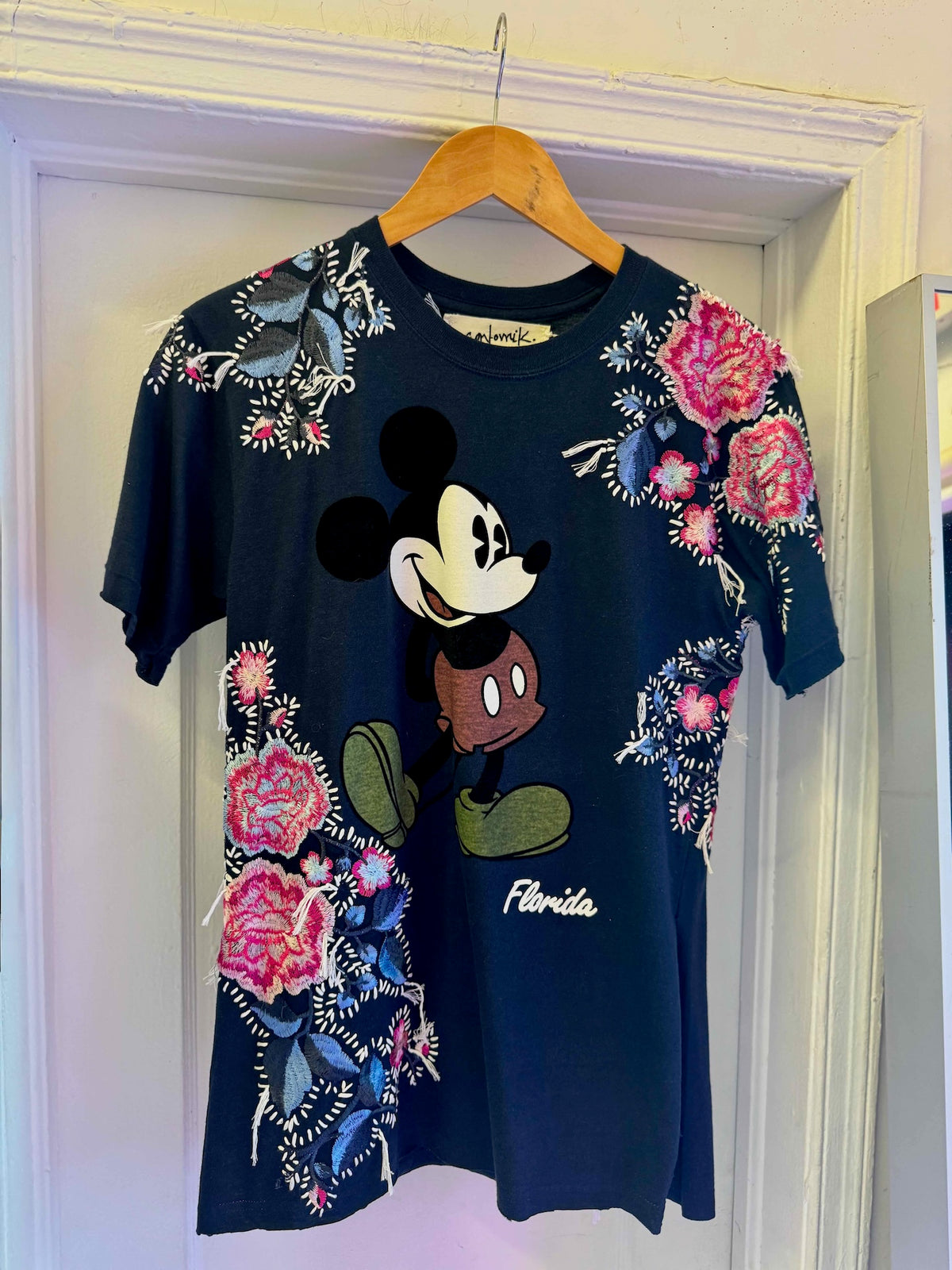 The Floridian Mickey T-Shirt
One-of-a-kind reclaimed t-shirt, hand-embroidered with vintage floral embroidery 