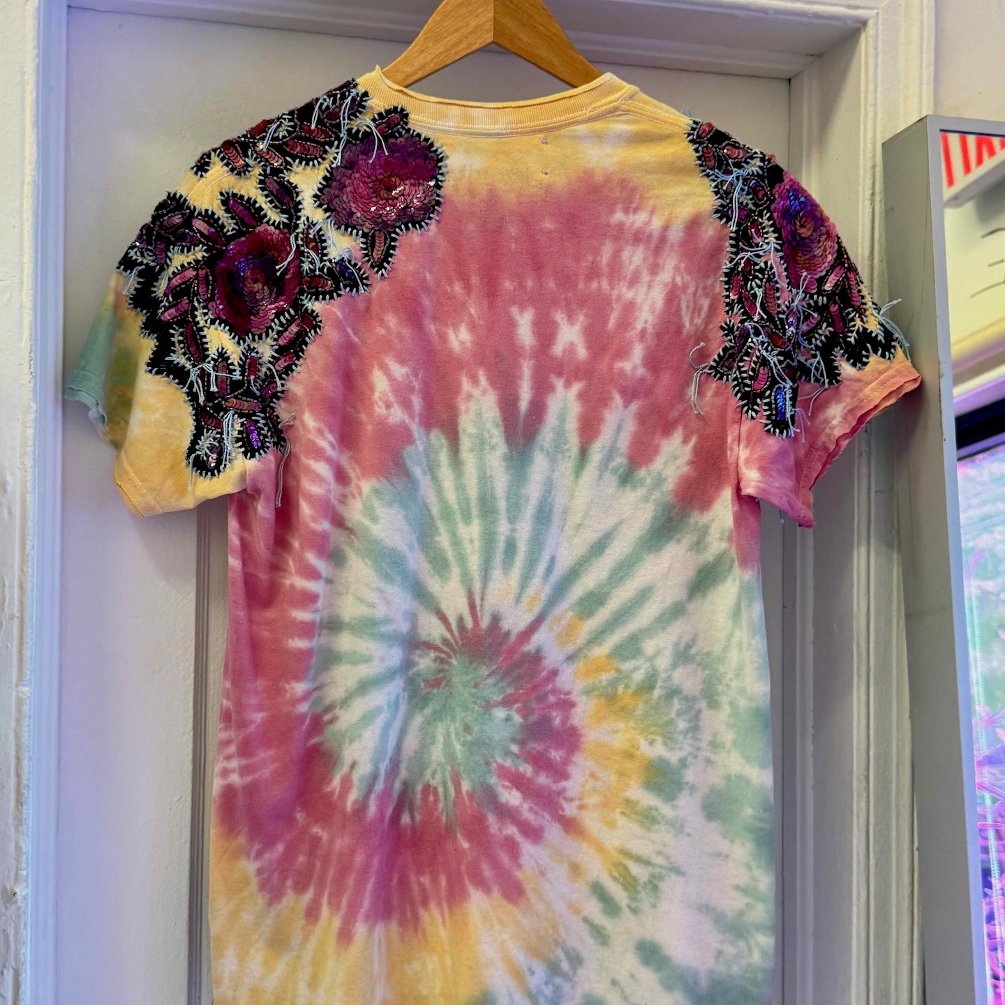 One-of-a-kind upcycled tie-dye Snoopy t-shirt with hand-embroidered sequin flowers by Gontovnik