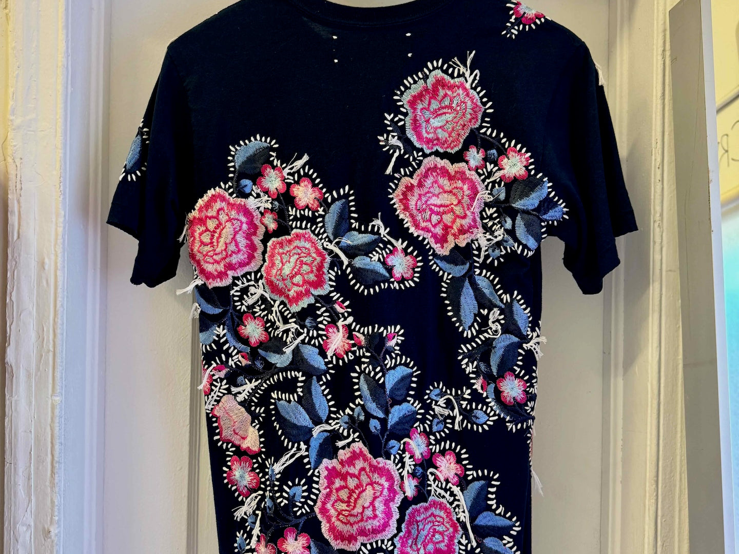 The Floridian Mickey T-Shirt
One-of-a-kind reclaimed t-shirt, hand-embroidered with vintage floral embroidery 