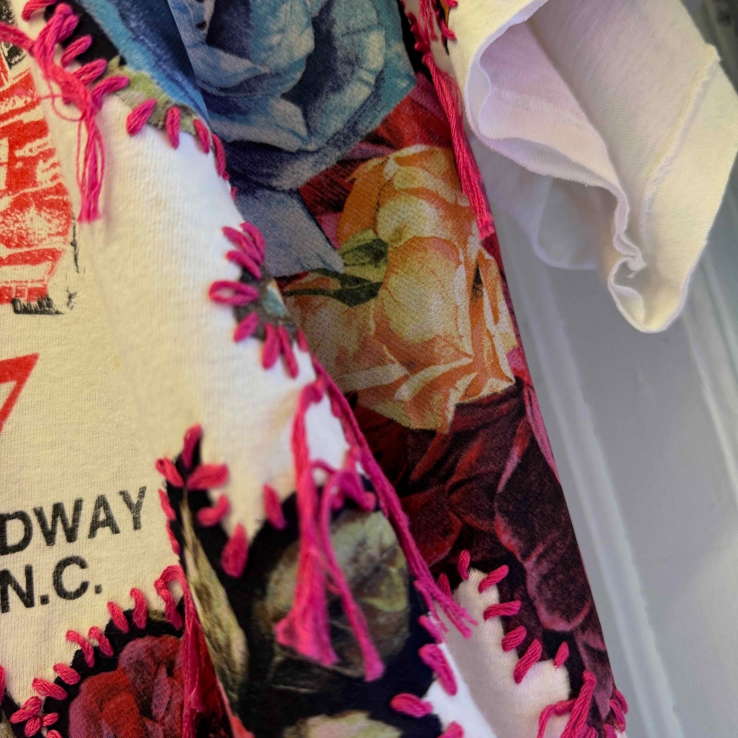 One-of-a-kind upcycled t-shirt with hand-stitched floral embroidery by Gontovnik