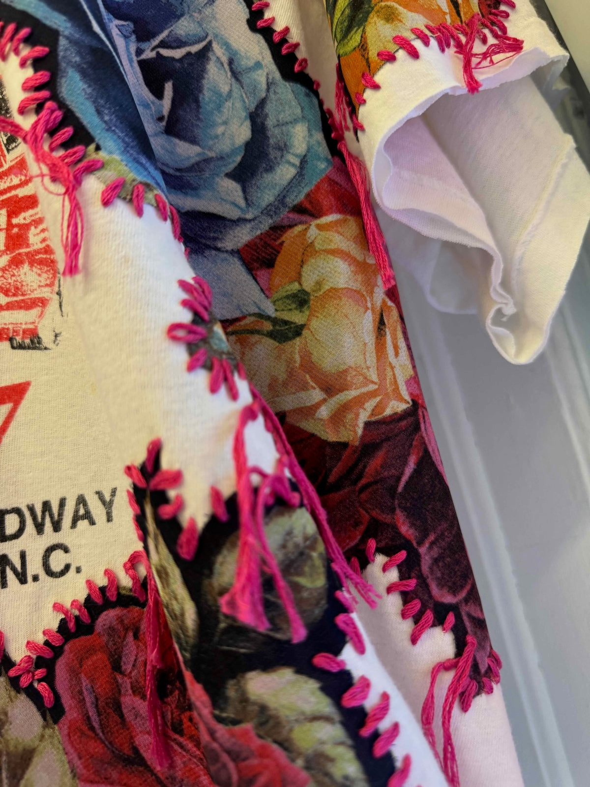 One-of-a-kind upcycled t-shirt with hand-stitched floral embroidery by Gontovnik